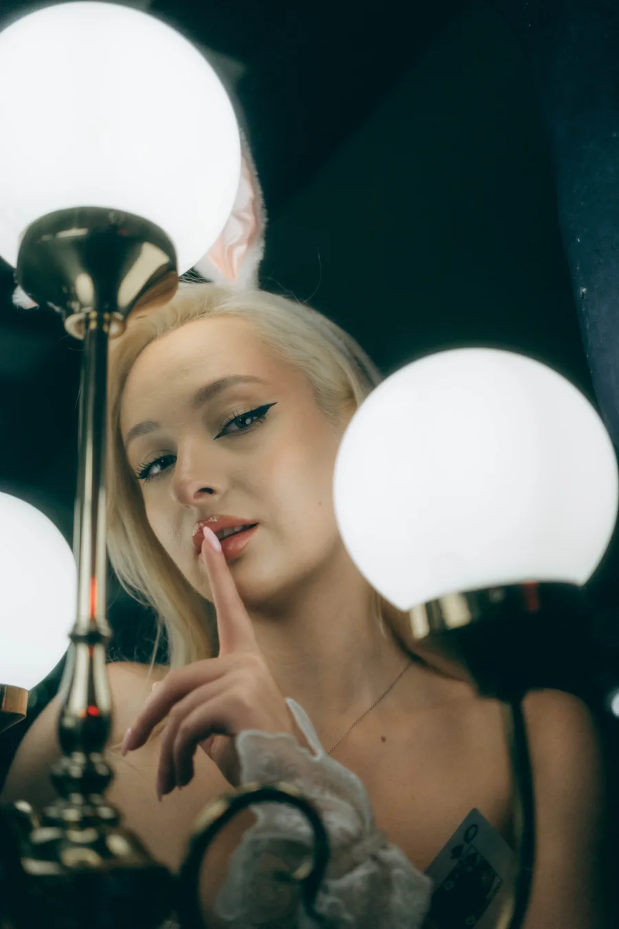Portrait of a woman surrounded by glowing round lights